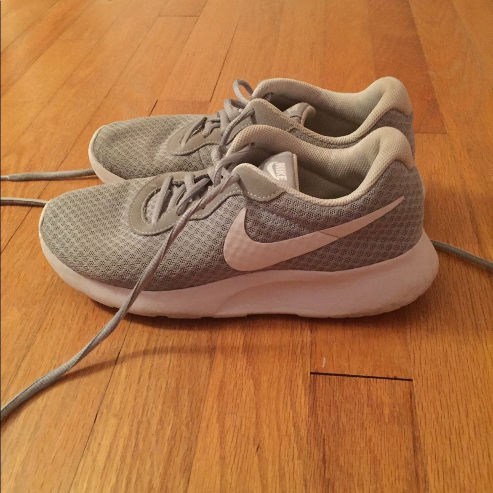 Gray and white Nike shoes